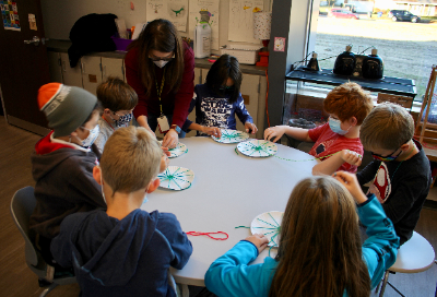 Students making weaving art