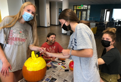 Students decorating pumpkins for Hispanic Heritage Month