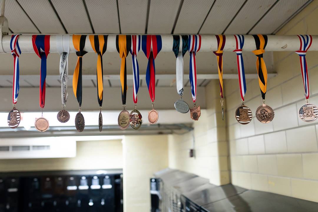 Medals hanging in a locker room