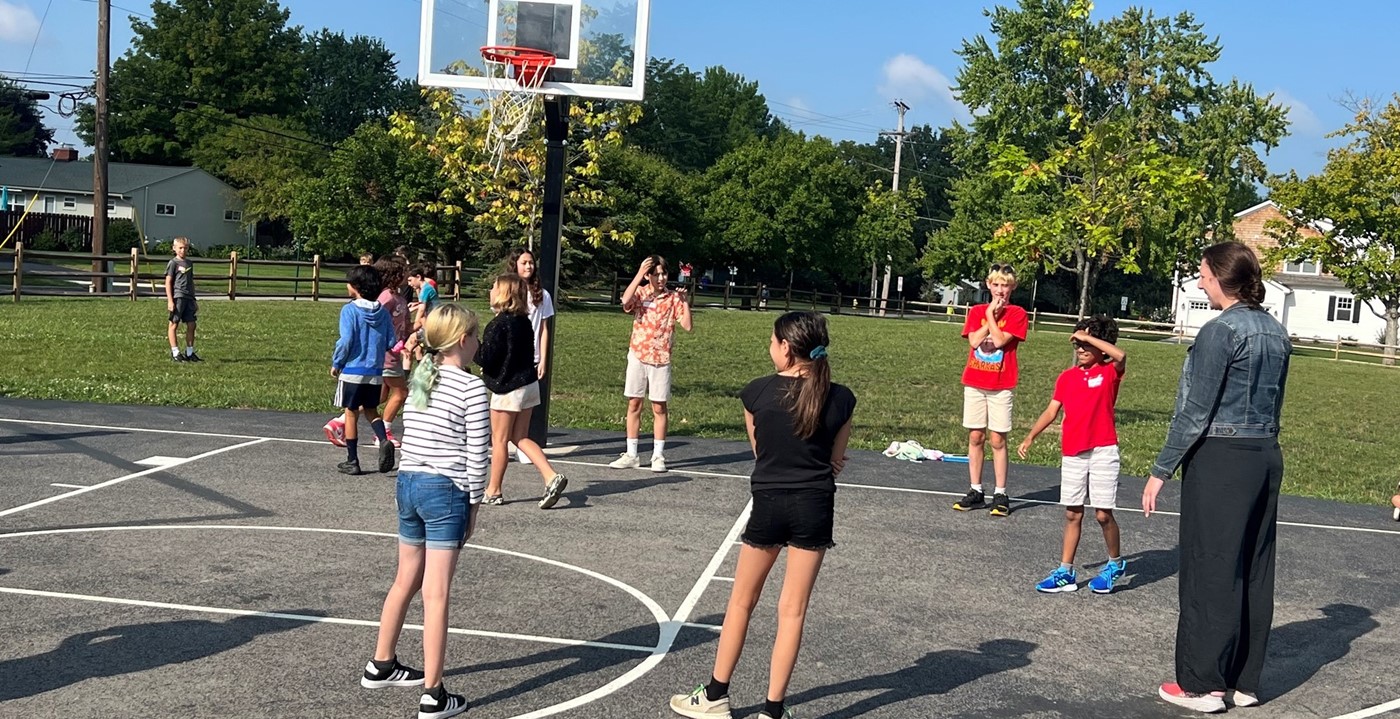 Students on basketball court at recess.