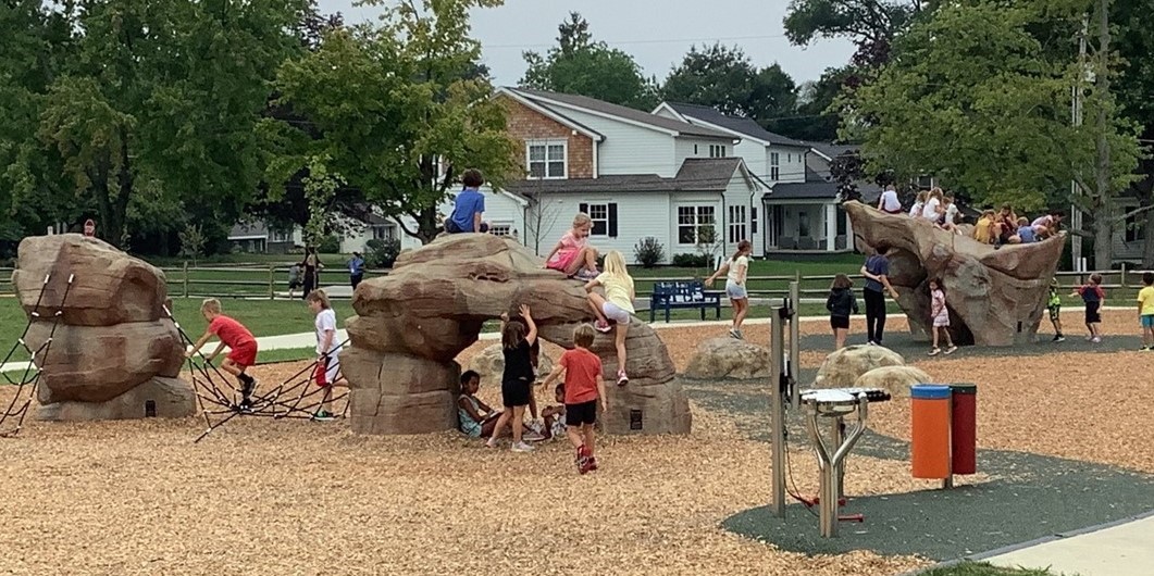 Students on rock playground at recess.